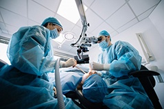 an oral surgeon performing dental implant placement