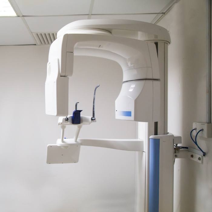 C T cone beam scanner against white wall of dental office