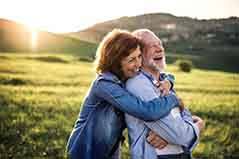 Couple embracing and enjoying the great outdoors