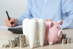 Coins next to a piggy bank
