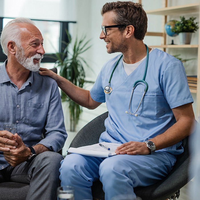 a dentist talking to his patient