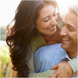 Man and woman hugging outdoors